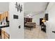 A view from the entry area of a living room with tile floors and a comfortable sofa at 388 Coronado Dr, Henderson, NV 89015