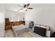 Comfortable main bedroom with wood-look floors and a built-in headboard with storage at 388 Coronado Dr, Henderson, NV 89015