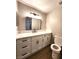 Bathroom featuring a vanity with a modern mirror at 4050 Pacific Harbors Dr # 209, Las Vegas, NV 89121