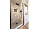 Beautiful bathroom includes a shower with modern fixtures and a laundry area at 4050 Pacific Harbors Dr # 209, Las Vegas, NV 89121