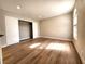 A bright bedroom features a closet, and natural light from the window at 4050 Pacific Harbors Dr # 209, Las Vegas, NV 89121