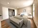 Comfortable bedroom featuring a large bed, bench, and spacious closet at 4050 Pacific Harbors Dr # 209, Las Vegas, NV 89121