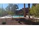 Community pool with mature trees and desert landscaping in a well maintained area at 4050 Pacific Harbors Dr # 209, Las Vegas, NV 89121
