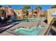 Community pool and hot tub surrounded by lush landscaping, perfect for relaxation and recreation at 4050 Pacific Harbors Dr # 209, Las Vegas, NV 89121