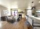 Inviting living room with fireplace, modern furniture, hardwood floors and access to the outside at 4050 Pacific Harbors Dr # 209, Las Vegas, NV 89121
