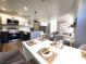 Bright, open-concept living space featuring modern kitchen, dining area and comfortable living room with stylish decor at 4050 Pacific Harbors Dr # 209, Las Vegas, NV 89121