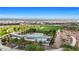 Capture the resort-style pool with lounge areas, surrounded by verdant landscaping, offering a refreshing escape at 410 Gracious Way, Henderson, NV 89011