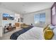 Bedroom with a window, tv, and view into the adjoining bathroom at 410 Gracious Way, Henderson, NV 89011