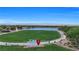 Aerial view of a community park featuring a lake, walking paths, and a large grassy area at 410 Gracious Way, Henderson, NV 89011