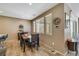 Bright dining area with modern decor, natural light, and seamless flow to outdoor patio at 410 Gracious Way, Henderson, NV 89011