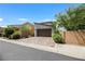 A modern two-story home features a brick driveway, a two-car garage, and well-manicured landscaping at 410 Gracious Way, Henderson, NV 89011