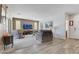 Bright living room with neutral tones, plush seating, and a large window with natural light at 410 Gracious Way, Henderson, NV 89011