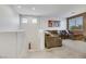 Open living area featuring a large sectional couch, recessed lighting, and neutral color palette at 410 Gracious Way, Henderson, NV 89011