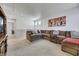 Comfortable upstairs living area with a large sectional sofa, TV, and a cozy atmosphere at 410 Gracious Way, Henderson, NV 89011