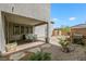 Covered patio featuring a stone paver patio and a view of the low maintenance backyard at 410 Gracious Way, Henderson, NV 89011