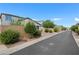 Neighborhood street view shows well-maintained homes with desert landscaping and paved sidewalks at 410 Gracious Way, Henderson, NV 89011