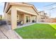 Great outdoor living with a covered patio, artificial turf, and space for fun activities at 4148 Campriani Ave, North Las Vegas, NV 89084