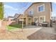 Spacious backyard with new turf, patio with dining set, and barbeque at 4148 Campriani Ave, North Las Vegas, NV 89084