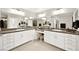 Spacious bathroom with dual sinks, large mirror, and abundant cabinet space at 4148 Campriani Ave, North Las Vegas, NV 89084