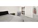 Bedroom with gray bedspread, furnishings, and a walk-in closet with door open at 4148 Campriani Ave, North Las Vegas, NV 89084