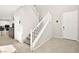 Welcoming entryway featuring tile flooring, stairs to the upper level, and access to the kitchen at 4148 Campriani Ave, North Las Vegas, NV 89084