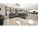 Expansive open-concept living room with tile floors flowing into the kitchen and dining area at 4148 Campriani Ave, North Las Vegas, NV 89084