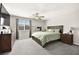 Comfortable main bedroom features carpet, ceiling fan and natural lighting at 4148 Campriani Ave, North Las Vegas, NV 89084