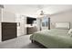 Spacious main bedroom includes carpet, window with blinds, TV, and dresser at 4148 Campriani Ave, North Las Vegas, NV 89084