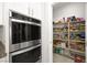 Convenient walk-in pantry with plenty of storage space and built in shelving at 4148 Campriani Ave, North Las Vegas, NV 89084