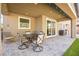 Covered patio area complete with stylish dining set, perfect for outdoor entertaining at 4148 Campriani Ave, North Las Vegas, NV 89084