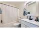 Well-lit bathroom featuring a shower-tub combo and a sleek vanity with a modern faucet at 4634 English Lavender Ave, North Las Vegas, NV 89031