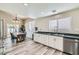 Open kitchen and dining area with stainless steel appliances, and sliding door to backyard at 4634 English Lavender Ave, North Las Vegas, NV 89031