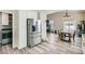 Kitchen with stainless steel refrigerator and view into dining area and backyard at 4634 English Lavender Ave, North Las Vegas, NV 89031
