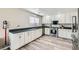 Bright kitchen with stainless steel appliances, white cabinets, and modern countertops at 4634 English Lavender Ave, North Las Vegas, NV 89031