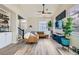 Bright living room featuring hardwood floors, modern furnishings, and ample natural light at 4634 English Lavender Ave, North Las Vegas, NV 89031