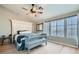 Serene main bedroom with hardwood floors, a spacious layout, and bright windows at 4634 English Lavender Ave, North Las Vegas, NV 89031