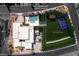 Aerial view of a custom estate on 1.07 acres featuring a pool, pickleball court, and lush landscaping at 505 Dragon Gate Ct, Henderson, NV 89012