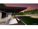 View of outdoor kitchen with a sport court and trampoline in a landscaped backyard at 505 Dragon Gate Ct, Henderson, NV 89012