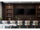 Modern bar features a sleek design with custom shelving and stylish bar stools at 505 Dragon Gate Ct, Henderson, NV 89012