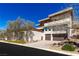 Modern two-story home with multiple balconies, a two-car garage, and desert landscaping at 505 Dragon Gate Ct, Henderson, NV 89012