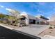Modern home showcasing xeriscaped landscaping and a multi-car garage with an elegant design at 505 Dragon Gate Ct, Henderson, NV 89012