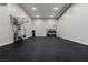 Extra large garage offering plenty of space and includes extra cabinets with a sink and a beverage cooler at 505 Dragon Gate Ct, Henderson, NV 89012