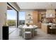 Kitchen dining area with a neutral color palette and a sliding glass doors to the patio at 505 Dragon Gate Ct, Henderson, NV 89012