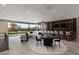 Entertain in this stylish living room featuring a full bar and seamless indoor-outdoor living at 505 Dragon Gate Ct, Henderson, NV 89012