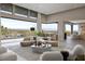 Expansive living area with great natural light, designer furniture, and picturesque views at 505 Dragon Gate Ct, Henderson, NV 89012