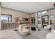 Open-concept living room provides ample seating and stunning views, seamlessly blending indoor and outdoor spaces at 505 Dragon Gate Ct, Henderson, NV 89012