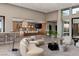 Spacious living room with floor-to-ceiling windows that provide abundant natural light and views at 505 Dragon Gate Ct, Henderson, NV 89012