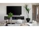 A contemporary living room showcases a sleek fireplace, a flatscreen TV, and stylish decor at 505 Dragon Gate Ct, Henderson, NV 89012