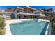 Stunning pool area offers a sleek pool and spa, perfect for relaxing and entertaining in style at 505 Dragon Gate Ct, Henderson, NV 89012