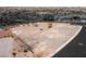 An aerial view of a vacant lot that is ready for building with privacy walls in place at 505 Dragon Gate Ct, Henderson, NV 89012